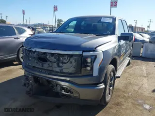 2022 Ford F-150 Lightning Pro with VIN 1FTVW1EL9NWG16717, listed as a IAAI auction lot 41290556 with 24,865 mi miles. Bid and sale history available at carsss.com. Image 2.
