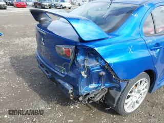 2015 Mitsubishi Lancer Evolution GSR with VIN JA32W8FV4FU012578, listed as a IAAI auction lot 41730742 with 64,762 mi miles. Bid and sale history available at carsss.com. Image 6.