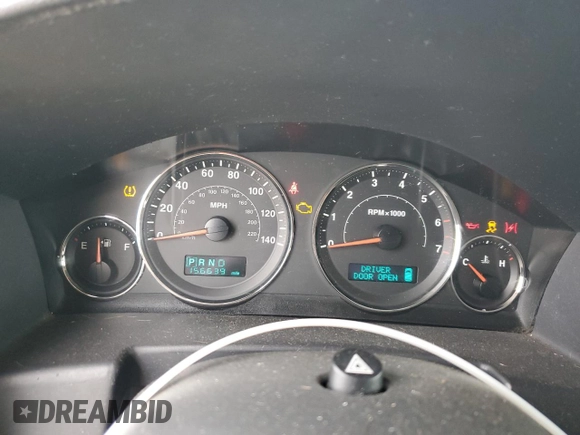 2007 Jeep Commander Sport z VIN 1J8HG48K97C527502, wystawiony jako Copart lot #52362625 z przebiegiem 156 639 mil mil oraz Czysty tytuł • Clean title. Historia ofert i sprzedaży dostępna na DreamBid. Obrazek 9.
