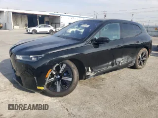 2022 BMW iX xDrive50 with VIN WB523CF06NCK55293, listed as a Copart auction lot 43126505 with 27,421 mi miles and Salvage Title. Bid and sale history available at carsss.com. Image 1.