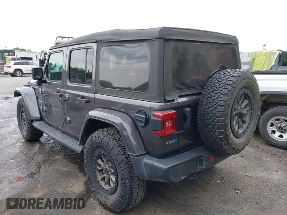 2021 Jeep Wrangler Unlimited Sahara with VIN 1C4JJXP60MW704738, listed as a IAAI auction lot 42042079 with 63,765 mi miles and . Bid and sale history available at DreamBid. Image 3.