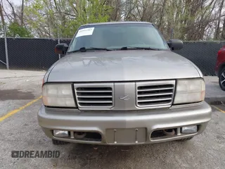 2001 Oldsmobile Bravada z VIN 1GHDT13WX12110603, wystawiony jako IAAI lot #41911383 z przebiegiem 164 916 mil mil oraz . Historia ofert i sprzedaży dostępna na DreamBid. Obrazek 6.