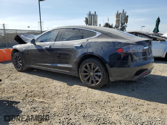 2014 Tesla Model S 60 with VIN 5YJSA1H13EFP38425, listed as a Copart auction lot 63686205 with 183,968 mi miles and Salvage title. Bid and sale history available at DreamBid. Image 2.