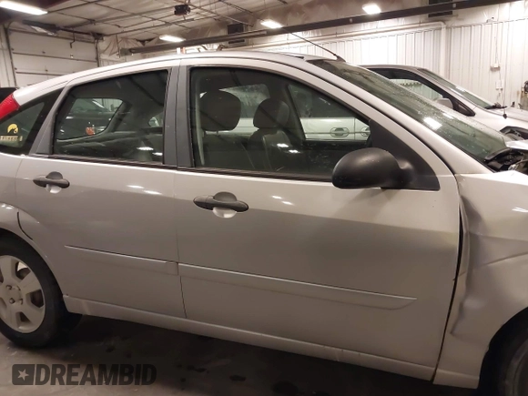 2007 Ford Focus S with VIN 1FAFP37NX7W330802, listed as a IAAI auction lot 41663895 with 147,015 mi miles and . Bid and sale history available at carsss.com. Image 14.