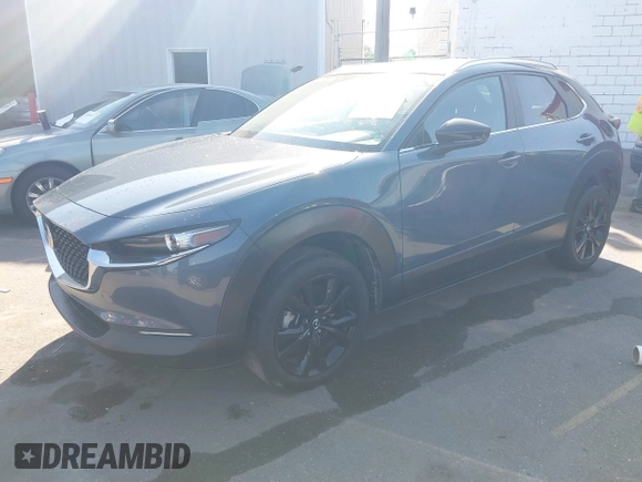 2022 Mazda CX-30 S Carbon Edition with VIN 3MVDMBCL6NM431985, listed as a IAAI auction lot 42610558 with Not provided miles and . Bid and sale history available at DreamBid. Image 16.