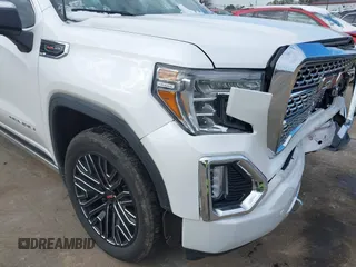 2020 GMC Sierra 1500 Denali z VIN 3GTU9FELXLG371258, wystawiony jako IAAI lot #41303490 z przebiegiem 63 571 mil mil oraz . Historia ofert i sprzedaży dostępna na DreamBid. Obrazek 17.