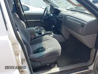 2003 Jeep Grand Cherokee Laredo z VIN 1J4GX48S33C519404, wystawiony jako IAAI lot #42164364 z przebiegiem 174 627 mil mil oraz . Historia ofert i sprzedaży dostępna na DreamBid. Obrazek 5.