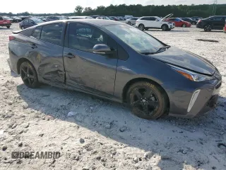 2022 Toyota Prius L Eco z VIN JTDKAMFU8N3173133, wystawiony jako Copart lot #54865615 z przebiegiem 100 876 mil mil oraz Szkoda całkowita • Salvage title. Historia ofert i sprzedaży dostępna na DreamBid. Obrazek 4.
