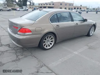 2004 BMW 7 Series 745Li with VIN WBAGN63494DS45716, listed as a IAAI auction lot 41906522 with 127,292 mi miles. Bid and sale history available at carsss.com. Image 4.