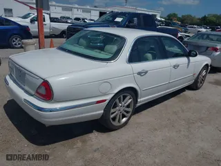 2004 Jaguar XJ with VIN SAJWA73BX4TG14270, listed as a IAAI auction lot 41905325 with 104,908 mi miles. Bid and sale history available at carsss.com. Image 4.