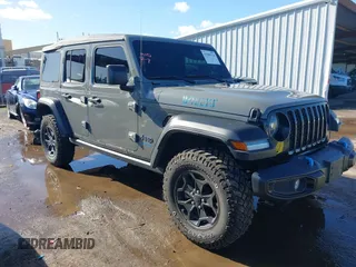 2023 Jeep Wrangler z VIN 1C4JJXN64PW592470, wystawiony jako IAAI lot #41509114 z przebiegiem 19 438 mil mil oraz . Historia ofert i sprzedaży dostępna na DreamBid. Obrazek 1.