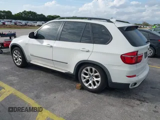 2011 BMW X5 35i with VIN 5UXZV4C54BL412770, listed as a IAAI auction lot 41618946 with 148,612 mi miles. Bid and sale history available at carsss.com. Image 3.