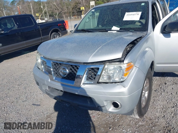 2013 Nissan Frontier SV with VIN 1N6AD0EV6DN720356, listed as a IAAI auction lot 41694570 with 243,279 mi miles and . Bid and sale history available at DreamBid. Image 6.