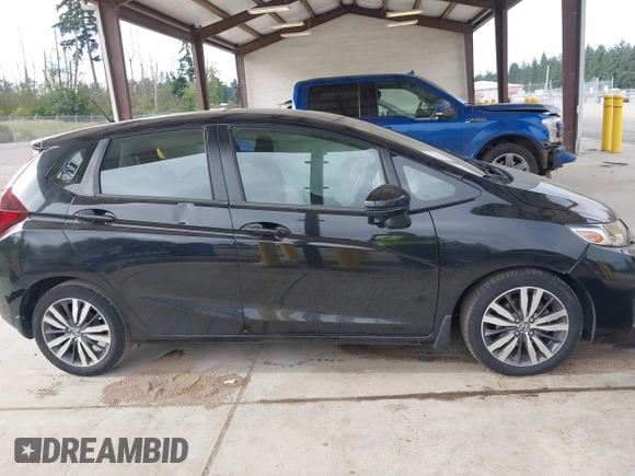 2015 Honda Fit EX-L z VIN 3HGGK5H81FM701122, wystawiony jako IAAI lot #42610165 z przebiegiem 74 969 mil mil oraz . Historia ofert i sprzedaży dostępna na DreamBid. Obrazek 14.