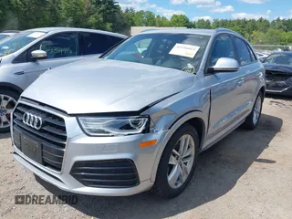 2018 Audi Q3 Premium with VIN WA1ECCFS0JR022112, listed as a IAAI auction lot 42356014 with 56,671 mi miles and . Bid and sale history available at DreamBid. Image 2.