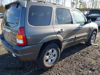 2003 Mazda Tribute LX with VIN 4F2CZ94133KM52401, listed as a IAAI auction lot 42142297 with Not Provided miles and . Bid and sale history available at carsss.com. Image 4.