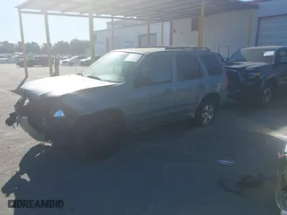 2003 Mazda Tribute ES with VIN 4F2CZ96123KM11822, listed as a IAAI auction lot 41279605 with 128,749 mi miles. Bid and sale history available at carsss.com. Image 16.