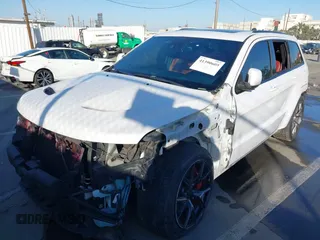 2017 Jeep Grand Cherokee SRT with VIN 1C4RJFDJ7HC600227, listed as a IAAI auction lot 41390600 with 96,841 mi miles. Bid and sale history available at carsss.com. Image 6.