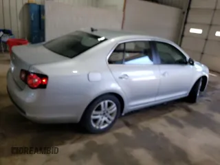 2009 Volkswagen Jetta z VIN 3VWAL71KX9M072304, wystawiony jako Copart lot #57027785 z przebiegiem 191 554 mil mil oraz Szkoda całkowita • Salvage title. Historia ofert i sprzedaży dostępna na DreamBid. Obrazek 3.