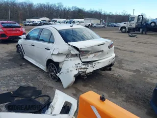2014 Mitsubishi Lancer Evolution MR with VIN JA32W5FV5EU017592, listed as a IAAI auction lot 41158408 with 97,614 mi miles. Bid and sale history available at carsss.com. Image 3.