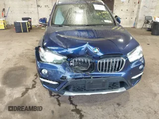 2019 BMW X1 xDrive28i with VIN WBXHT3C55K5L37338, listed as a IAAI auction lot 41934461 with 87,913 mi miles. Bid and sale history available at carsss.com. Image 6.