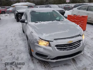 2015 Chevrolet Cruze LS z VIN 1G1PA5SH6F7240786, wystawiony jako IAAI lot #41614478 z przebiegiem 103 978 mil mil oraz . Historia ofert i sprzedaży dostępna na DreamBid. Obrazek 1.