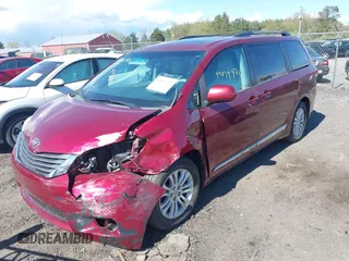 2014 Toyota Sienna XLE with VIN 5TDYK3DC8ES457940, listed as a IAAI auction lot 42039472 with 99,769 mi miles and . Bid and sale history available at DreamBid. Image 2.