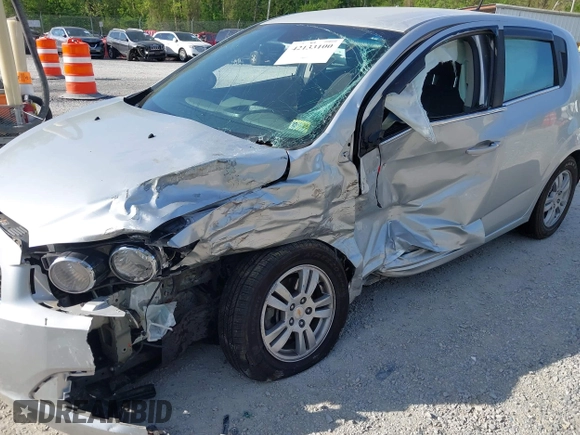 2012 Chevrolet Sonic LT with VIN 1G1JC6SH5C4167574, listed as a IAAI auction lot 42133100 with 59,473 mi miles and . Bid and sale history available at DreamBid. Image 6.