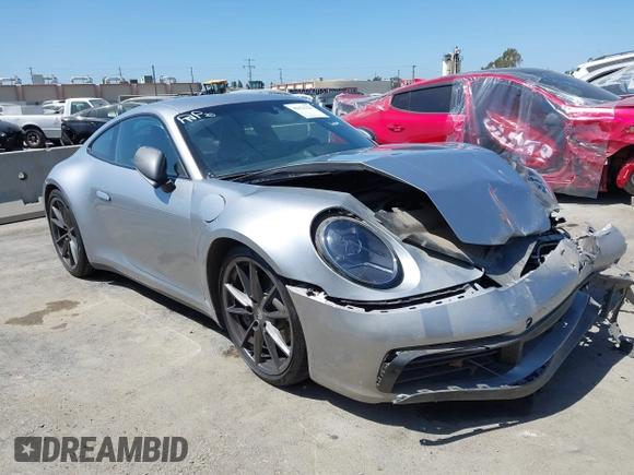 2023 Porsche 911 Carrera with VIN WP0AA2A93PS206048, listed as a IAAI auction lot 42022225 with 6,439 mi miles and . Bid and sale history available at DreamBid. Image 1.