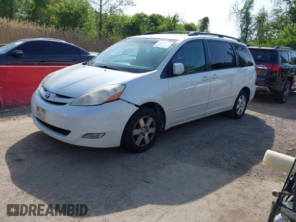 2009 Toyota Sienna XLE with VIN 5TDZK22C19S262107, listed as a IAAI auction lot 42158864 with 186,711 mi miles. Bid and sale history available at carsss.com. Image 2.