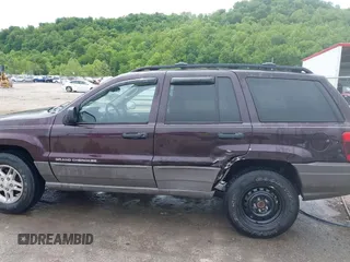 2004 Jeep Grand Cherokee Laredo z VIN 1J4GW48S94C209326, wystawiony jako IAAI lot #42309565 z przebiegiem 159 429 mil mil oraz . Historia ofert i sprzedaży dostępna na DreamBid. Obrazek 14.