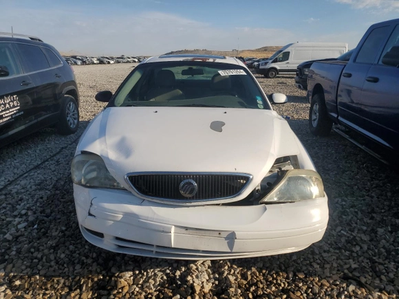 2000 Mercury Sable z VIN 1MEFM53U7YG640279, wystawiony jako Copart lot #70701264 z przebiegiem 118 790 mil mil oraz Szkoda całkowita • Salvage title. Historia ofert i sprzedaży dostępna na DreamBid. Obrazek 5.