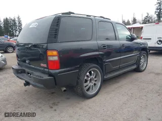2003 GMC Yukon Denali with VIN 1GKEK63U73J310098, listed as a IAAI auction lot 41831615 with 262,134 mi miles. Bid and sale history available at carsss.com. Image 4.