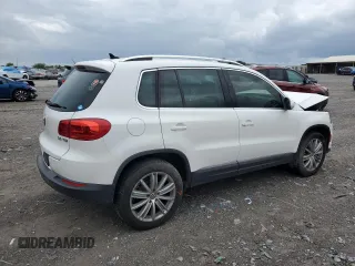 2014 Volkswagen Tiguan SE z VIN WVGAV3AX5EW551477, wystawiony jako Copart lot #55773245 z przebiegiem 153 437 mil mil oraz Czysty tytuł • Clean title. Historia ofert i sprzedaży dostępna na DreamBid. Obrazek 3.