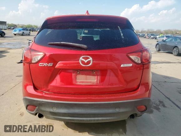 2014 Mazda CX-5 Touring with VIN JM3KE2CY1E0323298, listed as a Copart auction lot 50421685 with 214,739 mi miles and Salvage Title. Bid and sale history available at DreamBid. Image 6.
