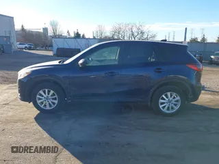 2014 Mazda CX-5 Touring with VIN JM3KE2CY8E0375009, listed as a IAAI auction lot 41420045 with 138,404 mi miles. Bid and sale history available at carsss.com. Image 14.