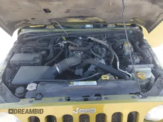 2010 Jeep Wrangler Sahara with VIN 1J4AA5D16AL203910, listed as a Copart auction lot 62891315 with 124,337 mi miles and Salvage title. Bid and sale history available at DreamBid. Image 12.