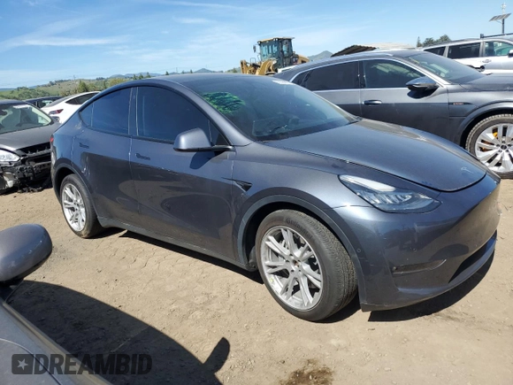 2022 Tesla Model Y Long Range with VIN 7SAYGDEE2NF402320, listed as a Copart auction lot 50396605 with 27,426 mi miles and Salvage Title. Bid and sale history available at DreamBid. Image 4.