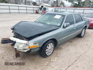 2005 Mercury Grand Marquis LS Premium z VIN 2MEHM75W45X662040, wystawiony jako IAAI lot #41697234 z przebiegiem 214 410 mil mil oraz . Historia ofert i sprzedaży dostępna na DreamBid. Obrazek 2.