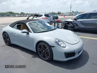 2019 Porsche 911 Carrera with VIN WP0CA2A98KS129145, listed as a IAAI auction lot 42500489 with 19,496 mi miles and . Bid and sale history available at DreamBid. Image 1.