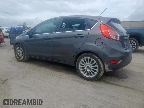 2015 Ford Fiesta Titanium z VIN 3FADP4FJ5FM203174, wystawiony jako Copart lot #60727515 z przebiegiem 91 898 mil mil oraz Czysty tytuł • Clean title. Historia ofert i sprzedaży dostępna na DreamBid. Obrazek 2.