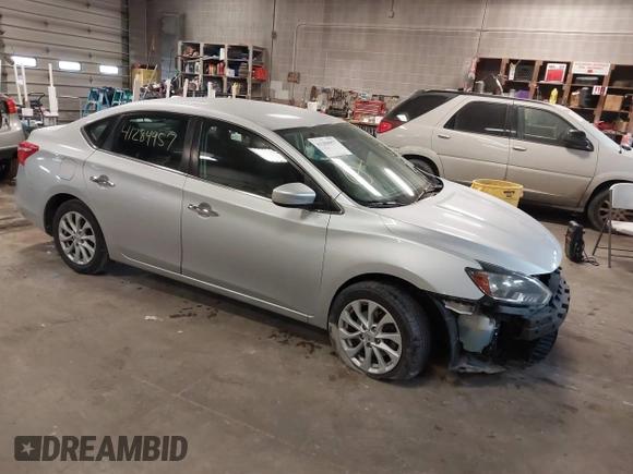 2019 Nissan Sentra S z VIN 3N1AB7AP7KY345072, wystawiony jako IAAI lot #41284957 z przebiegiem 104 084 mil mil oraz . Historia ofert i sprzedaży dostępna na DreamBid. Obrazek 1.