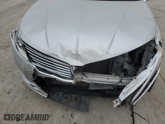2015 Lincoln MKZ z VIN 3LN6L2G93FR624560, wystawiony jako Copart lot #43999515 z przebiegiem 125 011 mil mil oraz Czysty tytuł • Clean title. Historia ofert i sprzedaży dostępna na DreamBid. Obrazek 13.