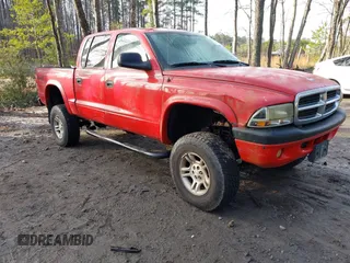 2004 Dodge Dakota Sport with VIN 1D7HG38N64S677103, listed as a IAAI auction lot 41665245 with 212,470 mi miles. Bid and sale history available at carsss.com. Image 1.