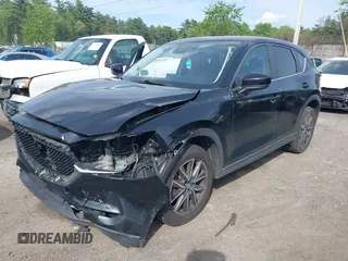 2018 Mazda CX-5 Touring z VIN JM3KFBCM9J0358997, wystawiony jako IAAI lot #42332606 z przebiegiem 93 952 mil mil oraz . Historia ofert i sprzedaży dostępna na DreamBid. Obrazek 18.