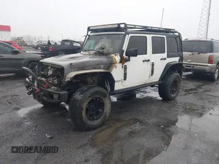 2016 Jeep Wrangler Unlimited Rubicon with VIN 1C4BJWFGXGL185227, listed as a IAAI auction lot 41555159 with 1 mi miles. Bid and sale history available at carsss.com. Image 2.