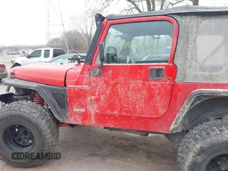 2002 Jeep Wrangler X z VIN 1J4FA39S52P708519, wystawiony jako IAAI lot #41569747 z przebiegiem 219 168 mil mil oraz . Historia ofert i sprzedaży dostępna na DreamBid. Obrazek 14.