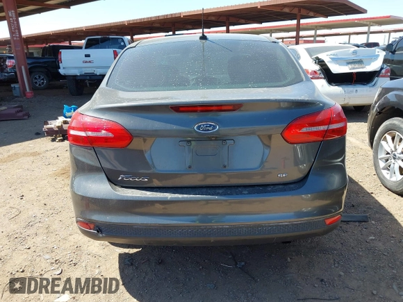 2018 Ford Focus SE with VIN 1FADP3FE6JL270910, listed as a IAAI auction lot 42130371 with 121,240 mi miles. Bid and sale history available at carsss.com. Image 16.