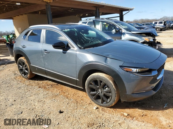 2022 Mazda CX-30 S Carbon Edition with VIN 3MVDMBCL0NM455876, listed as a Copart auction lot 48141545 with 11,873 mi miles and Salvage title. Bid and sale history available at DreamBid. Image 4.