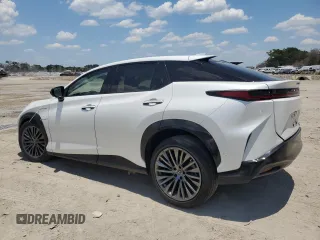 2023 Lexus RZ 450e Premium z VIN JTJAAAAB7PA001851, wystawiony jako Copart lot #57144464 z przebiegiem 3731 mil mil oraz Szkody całkowita. Historia ofert i sprzedaży dostępna na DreamBid. Obrazek 2.